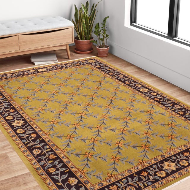 Enhance the ambiance of your home with this magnificent Persian-influenced Turkish hand-knotted rug made by skilled...