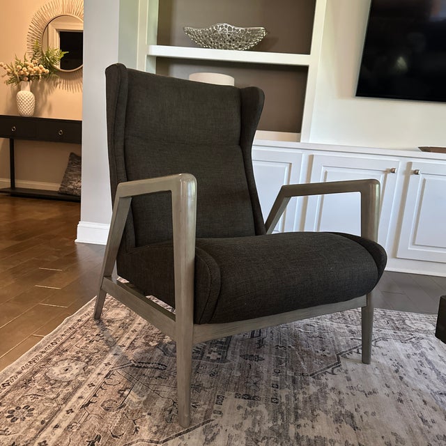 Beautiful designer accent chair by Lillian August Fine Furniture. This chair features a modern angular wood frame with a...