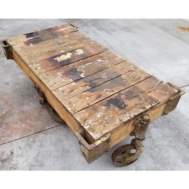 Bring authentic history and rugged sophistication into your space with this stunning vintage industrial factory cart...