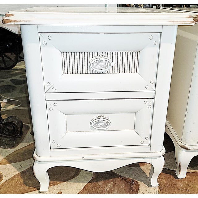 Shabby and still chic, a pair of French country style L XV nighstands in a chippy white finish, solid pegged construction...