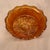 The item shown is a vintage Fenton Art Glass marigold carnival glass footed bowl featuring the iconic Butterfly and Berry...