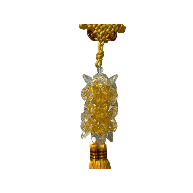 Infuse your space with traditional elegance and auspicious energy using this exquisite decorative hanging ornament....