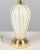 A Mid Century Murano glass lamp by Seguso. Hand-blown white cased glass with pulveri, or gold dust, creating a beautiful...