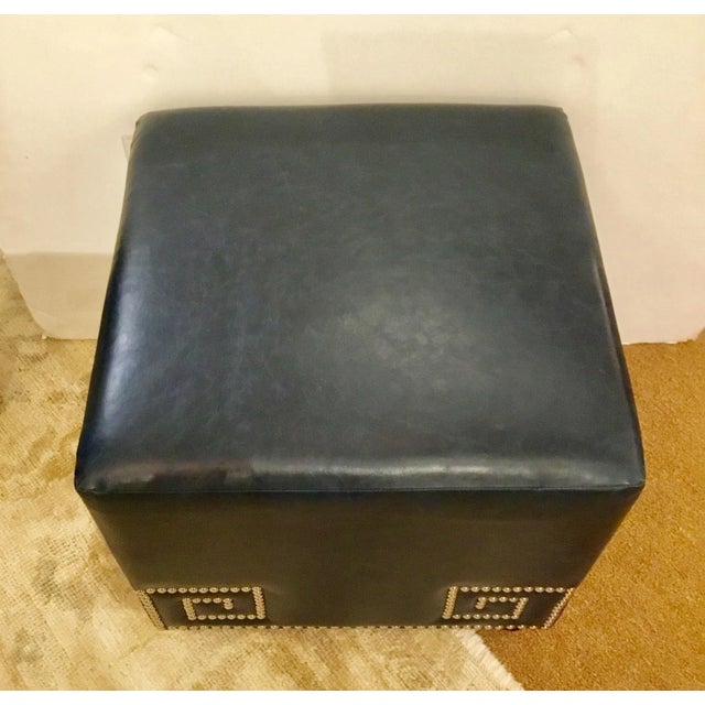 Stylish modern Furniture Classics Blue Leather Meander Ottoman, chrome Greek key nailhead design, showroom floor sample
