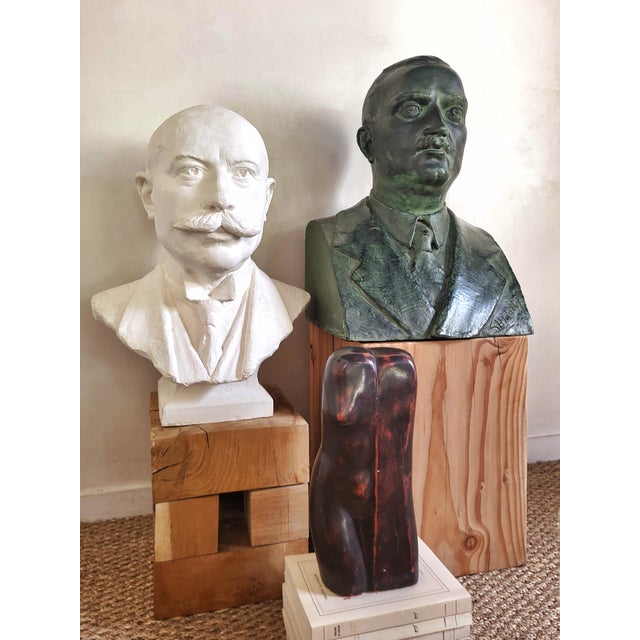 Bronze bust signed on the front (signature not deciphered).