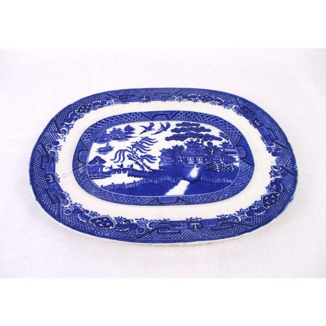 This lovely platter was made in England and has a deep cobalt color. It's marked "Made in England" on the back, but I'm...