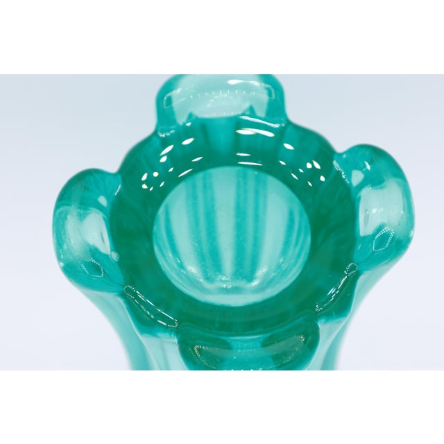 This breathtaking vase, designed by Rudolf Schröter for Rudolfova Hut in 1958, is far more than just a decorative object....