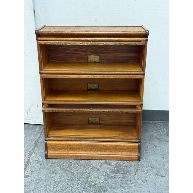 Design Plus Gallery presents an Antique Barrister Bookcase from The Globe-Wernicke Company. This early barrister bookcase...