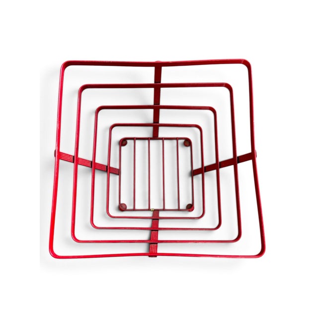 Fantastic vintage red wire storage basket with a bold geometric, Atomic-era silhouette. Constructed from ribbed red metal...