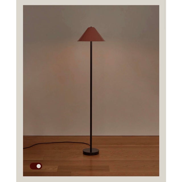 A charismatic floor lamp with a novel sense of scale. Slim but self-supporting, its machined metal frame—featuring a shade...