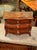 This product is a 19th century Italian miniature inlaid walnut commode, which is a decorative collectible item. The...