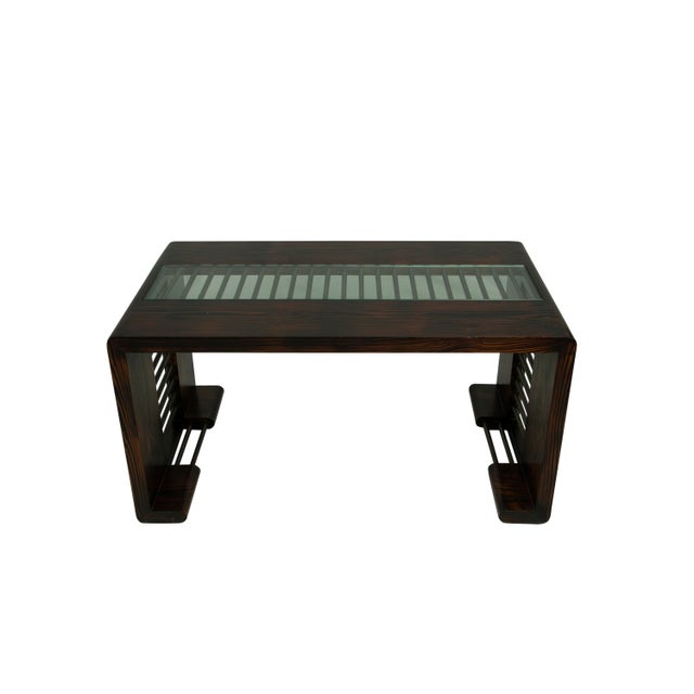 A fabulous waterfall design-style wood coffee or cocktail table. It has great textured wood grains and features brass bars...