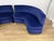 Pair of curved sofas in blue velvet with brass bases, made in Italy in the 20th century. The sofas have been cleaned, with...