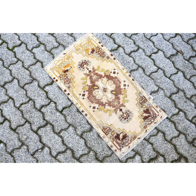 This is a vintage Turkish Oushak rug from the 1960s. The piece was hand-knotted.