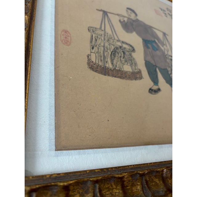 Antique framed Chinese woodblock watercolor painting on rice paper depicting a traditional street vendor from the Qing...