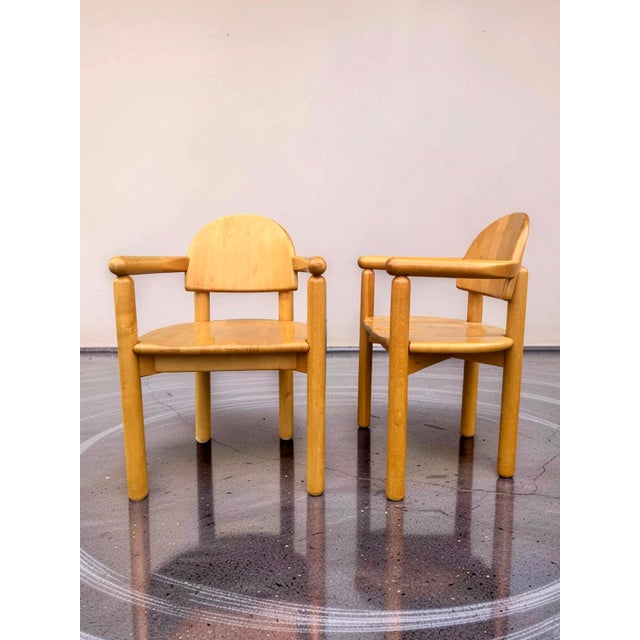 This rare and complete set of eight dining chairs, consisting of six armless chairs and two armchairs, is characterized by...