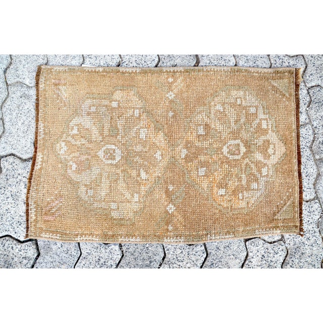 This is a vintage Turkish Oushak rug from the 1960s. The piece was hand-knotted.