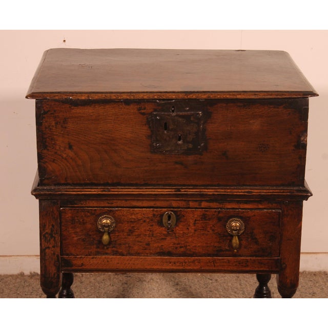 Superb and unique small 17th-century oak Bible chest. This small table or side table boasts an exceptional patina. It...
