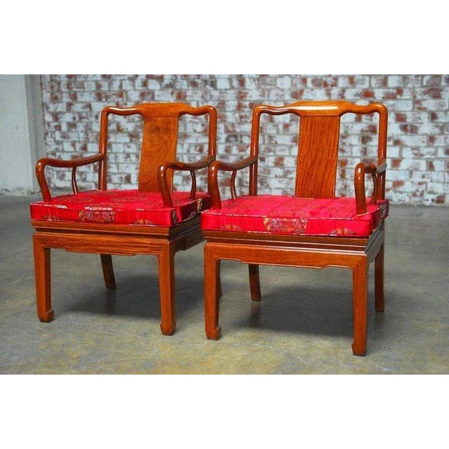 Exceptional pair of Chinese carved rosewood chairs made in the Qing style featuring fantastic radiant grain rosewood free...
