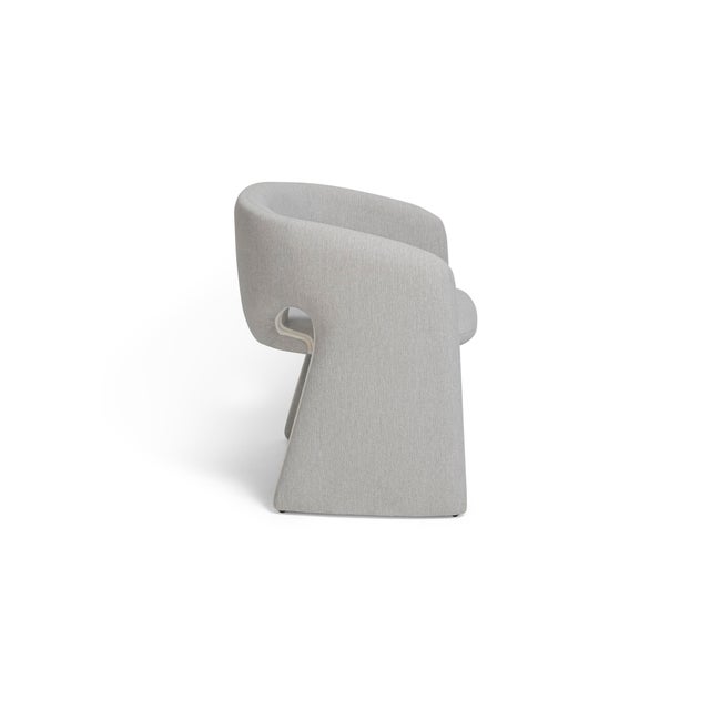 The CC Dining Chair embodies contemporary elegance through its balanced proportions and refined modern silhouette....