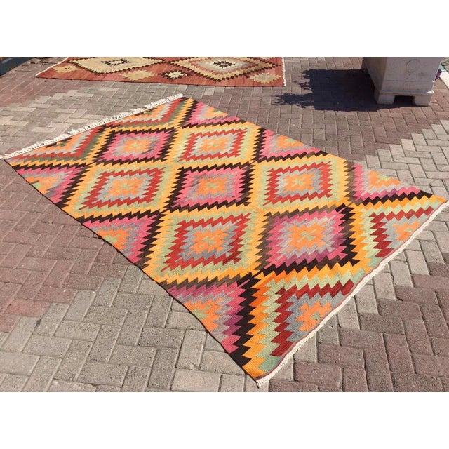 This beautiful, vintage, handwoven kilim is approximately 60 years old. It is handmade, of very fine quality hand spun...
