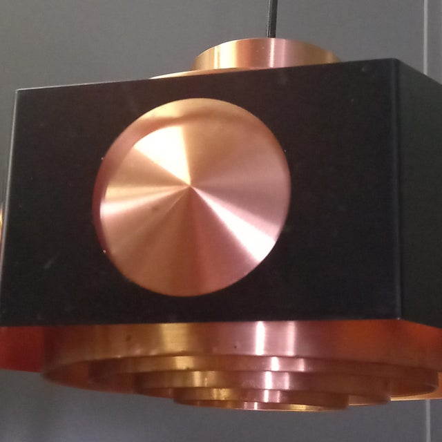 A vintage space age ceiling lamp in copper and black metal, designed by norwegian designer birger hammerstad and...