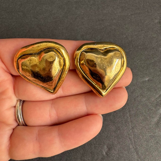 Vintage Puffy Heart Earrings Gold Tone Clip On Statement Jewelry 80s Designer Vintage condition with light general wear,...