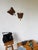 Set of two 1900s sculptures – wall decorations depicting butterflies. Made of hammered and chiseled wood, we love the raw,...