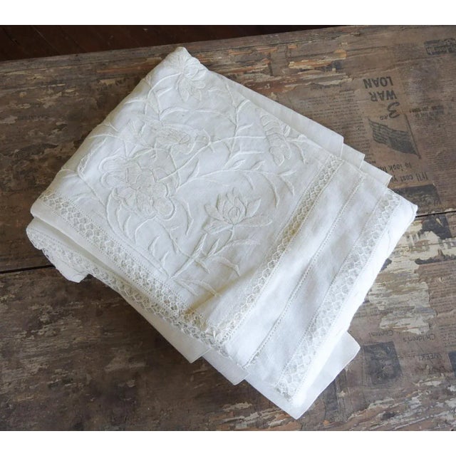 Antique early 20th century white linen organza tablecloth with hand emboidered and drawn thread whitework of birds and...
