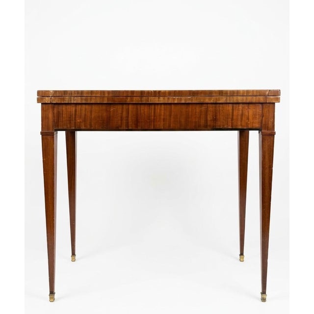 Elegant Louis XVI–style walnut fold-top games table, early 1900s, inspired by late 18th-century French neoclassical...