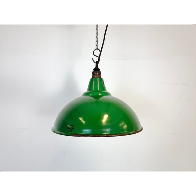 Industrial green enamel pendant light made by maxlume in great britain during the 1960s. White enamel inside the shade....