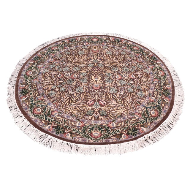 This hand‑knotted Pak Persian round rug showcases the finest expression of traditional Persian artistry. Each piece is...