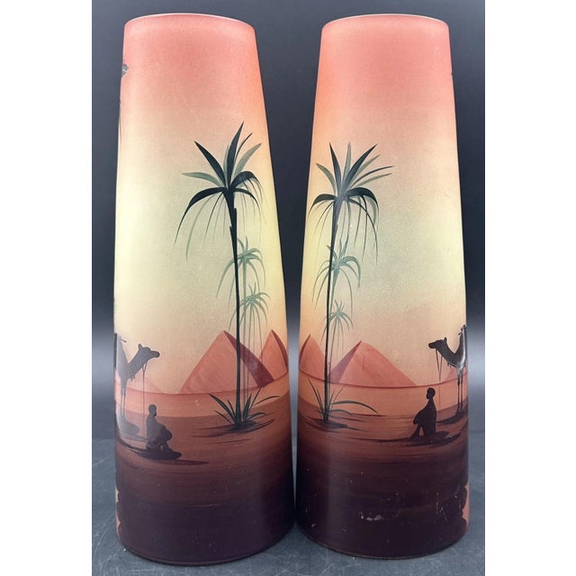 Each vase measures approximately 9 5/8 inches tall, 2 3/8 inches wide at the top rim, and 3 1/2 inches wide at its base....