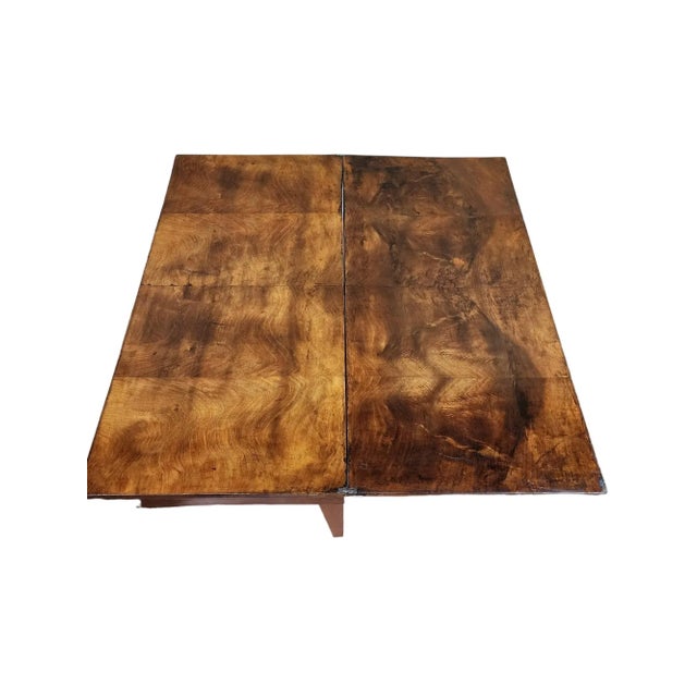 Striking burl walnut Biedermeier flip top tea table in very good condition. Top swivels to flip open, no extra leg to...