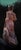 Into the Night depicts a solitary figure draped in a flowing white garment, standing against a deep, dark backdrop that...