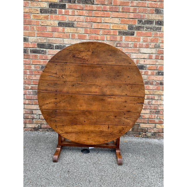 This 19th-century French wine table exudes timeless elegance, crafted with intricate detailing and deep rich wood. Its...