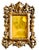 A gilt bronze photo frame, intricately adorned with a cherub and designed in the Neoclassical or Louis XVI style. This...
