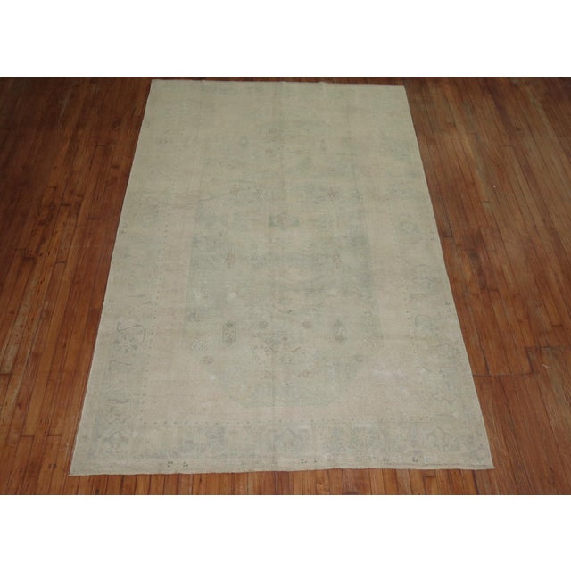 MId 20th century Pale green and cream Turkish Oushak rug Measures: 6' x 9'4''.