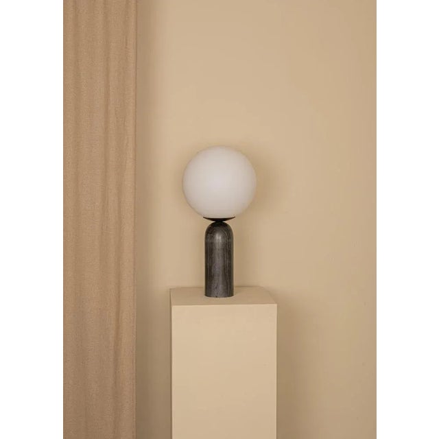 Black marble and steel atlas table lamp by simone & marcel dimensions: ø 30 x h 60 cm. Materials: glass, steel and black...