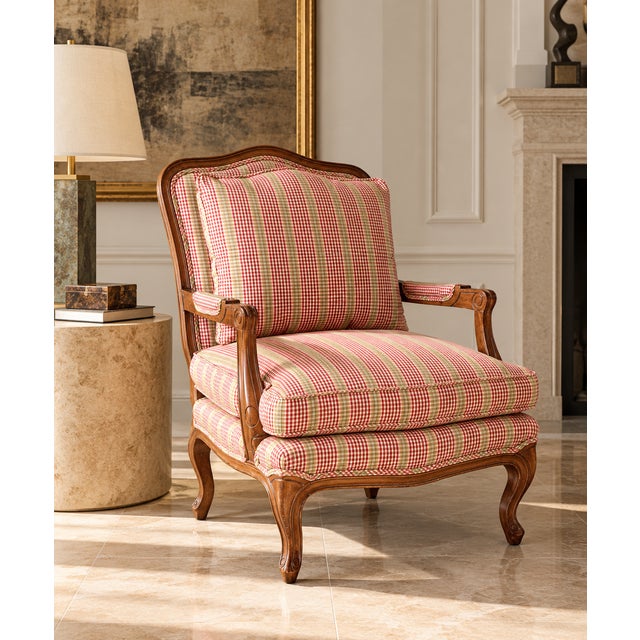 A handsome vintage bergère lounge chair by Century Furniture, featuring classic French-inspired styling and a beautifully...