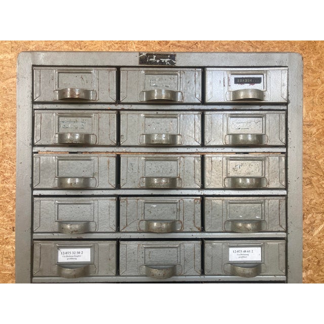 Chest of drawers from a metal workshop. Formerly used for storing small parts. The cabinet has 66 drawers with metal...
