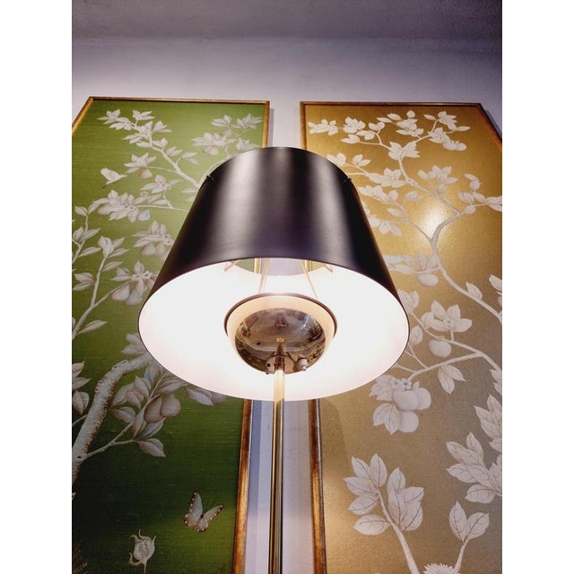 Stunning floor lamp model 2564 by Josef Frank for Svenskt Tenn, Sweden, 1950s. The polished and black lacquered brass stem...