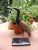 A sculpture, I believe a stylized grey heron, crafted using an impressive marble mosaic technique. The beak has been...