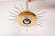 A unique pair of "sunburst" ceiling lamps, made in italy during the 1950s. each lamp features a circular, lacquered metal...