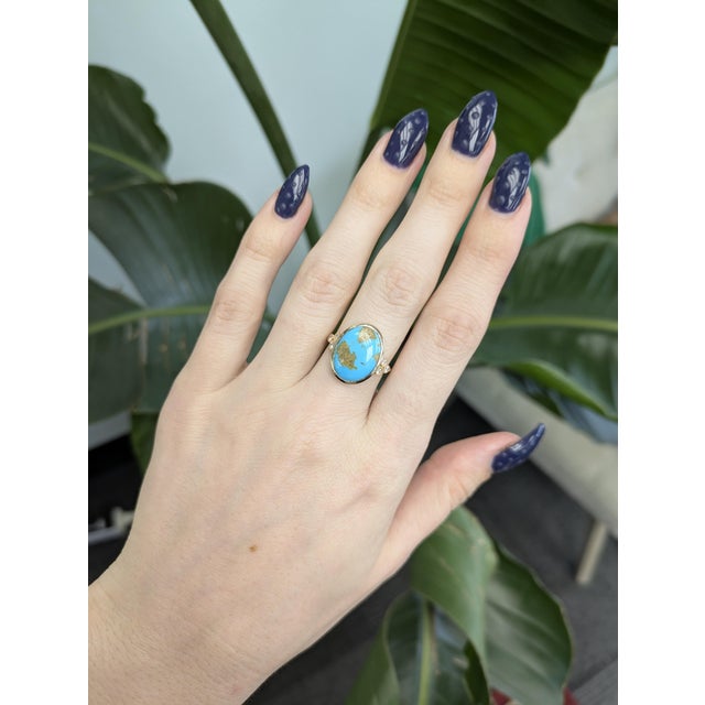 5.4ct Sonoran Turquoise Ring accented with natural diamonds, showcasing a vibrant 16 × 12mm gemstone. Crafted in solid 14K...