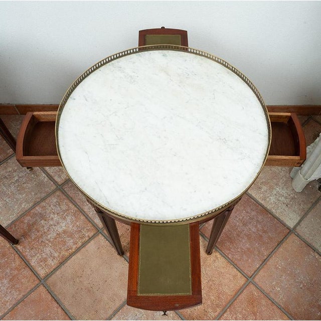 Pair of antique Napoleon III side tables in solid mahogany dating back to the early 20th century. The circular top...