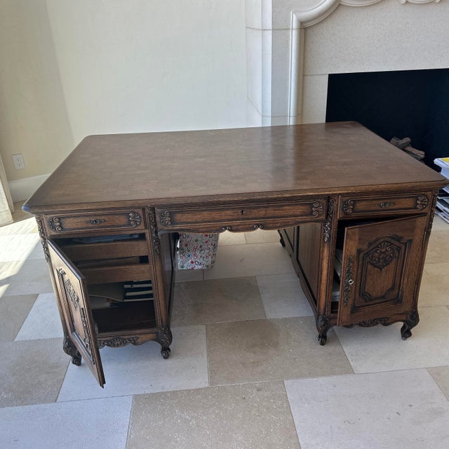 This is a substantial antique style partners desk designed in the French Provincial or Louis XV aesthetic. Constructed of...