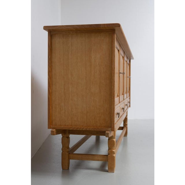Danish Mid-Century Brutalist Oak Sideboard by Henning Kjærnulf for EG, 1960s. Scandinavian Mid-Century Modern tall...