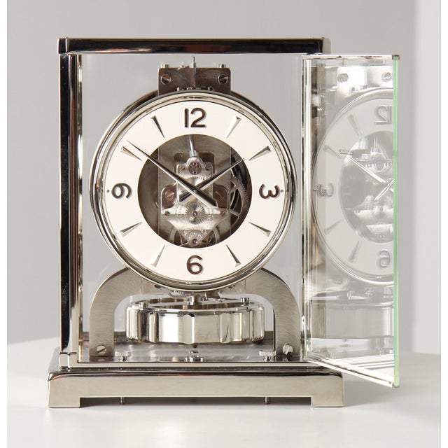 Silver atmos clock by jaeger lecoultre switzerland nickel-plated brass year of manufacture 1956 dimensions: h x w x d: 22...