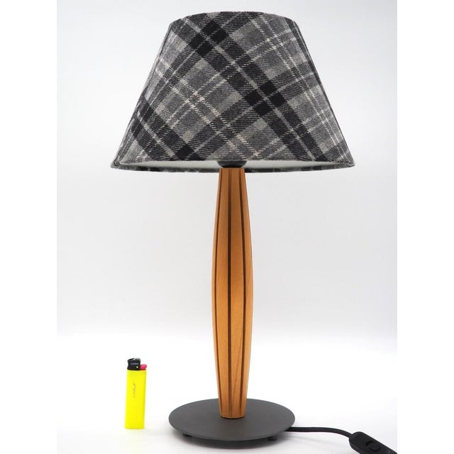 A stylish wooden table lamp in nordic design from ikea. The matching lampshade is made of a soft and durable fabric. a...
